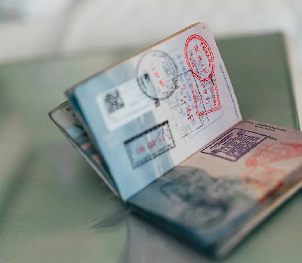 Bali Visas: Passport adorned with journey stamps.