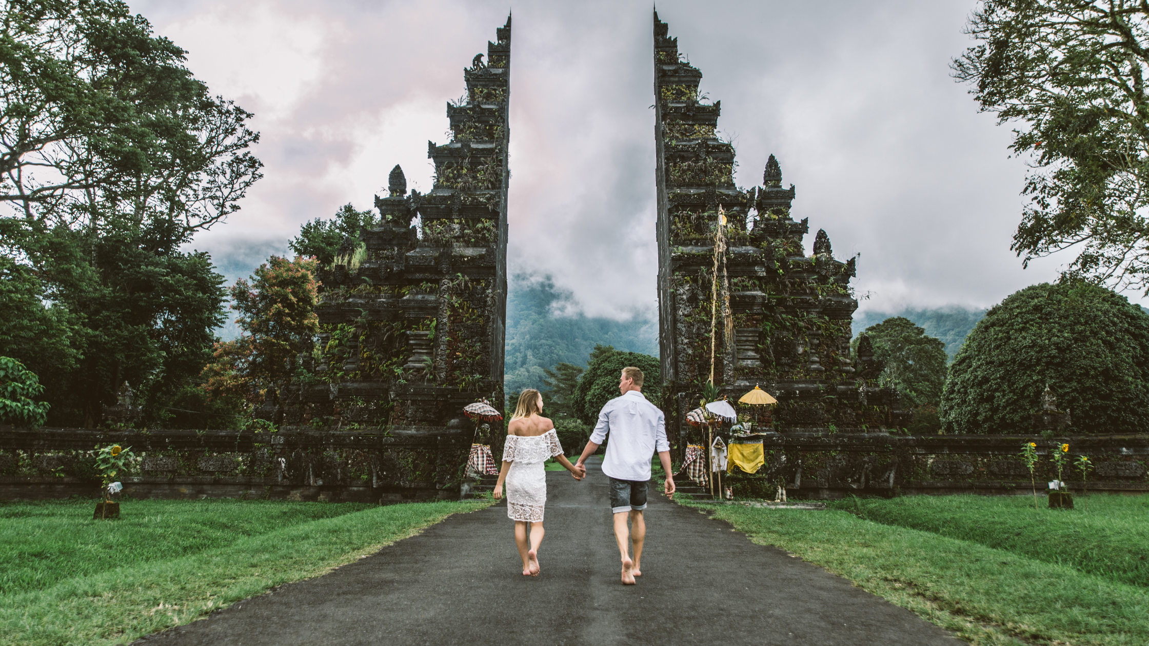 A stunning view of Tanah Lot Temple, perched on a rocky island with the ocean surrounding it, a symbol of Bali's cultural heritage.